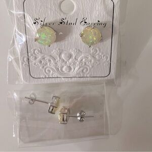 Two pair of gilttery, opal like stud earrings